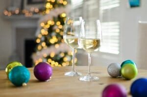 two champagne glasses near baubles